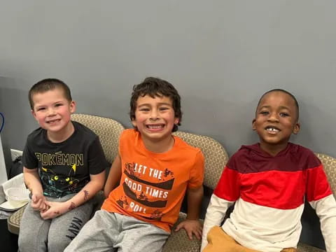 a group of boys sitting on a couch