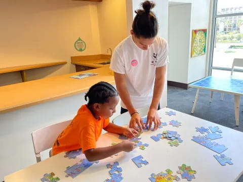 a man and a boy painting