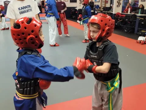 a boy and a girl wearing helmets