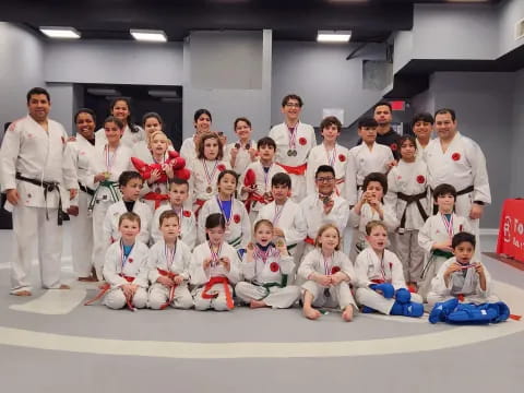 a group of people in karate uniforms