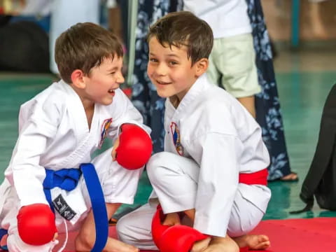 two boys in karate uniforms