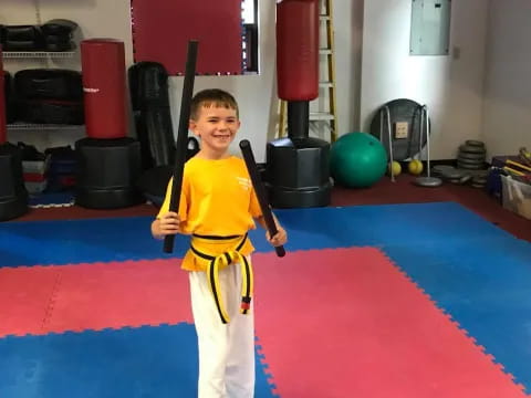 a boy holding a baseball bat
