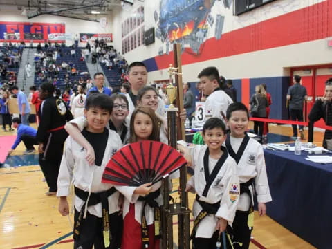 a group of children in karate uniforms