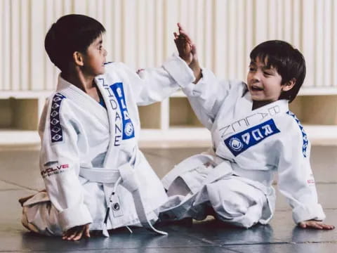 two boys in karate uniforms