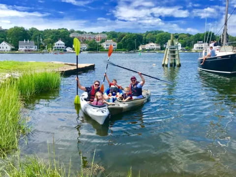 a group of people rowing a boat