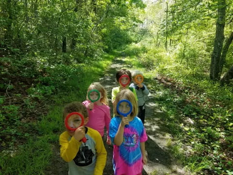 a group of children wearing masks