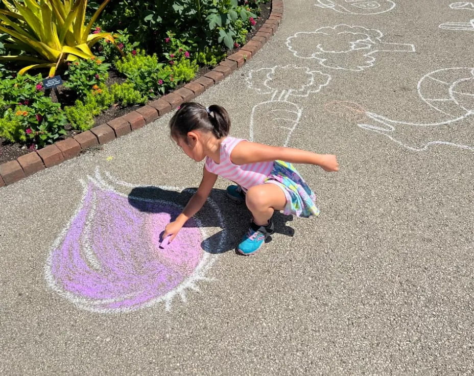 a girl playing in the street