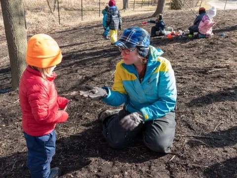 a person and a child in a park