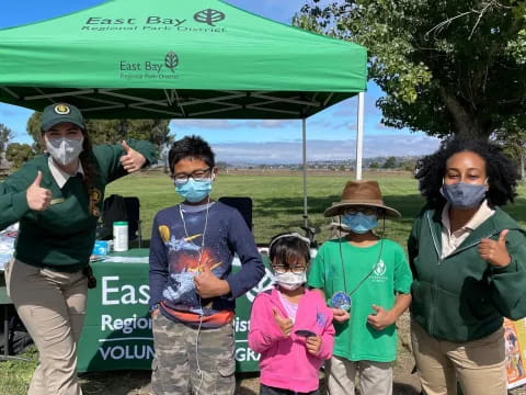a group of people wearing masks