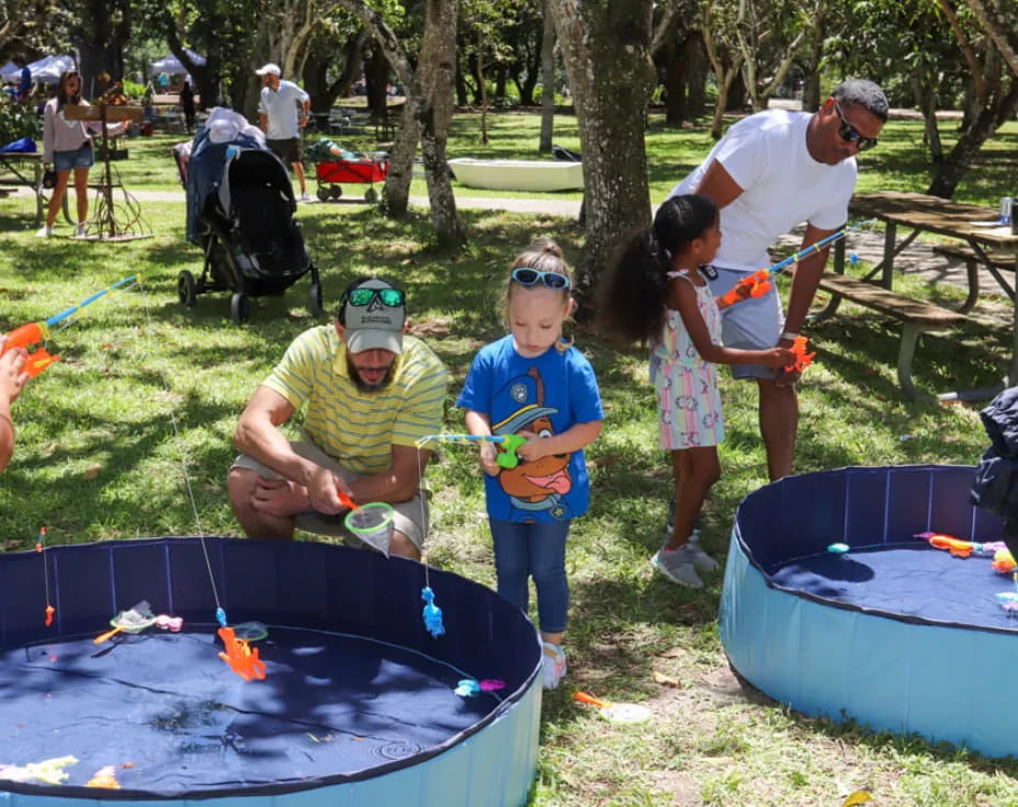 a group of people playing with toys