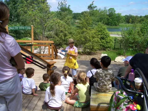 a group of people sitting on a deck