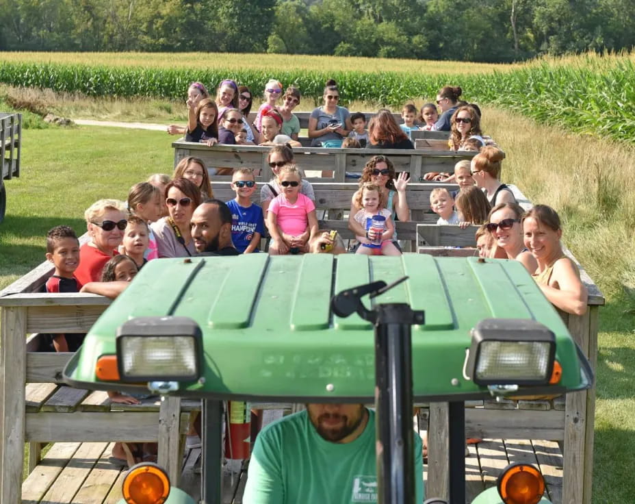 a group of people on a tractor