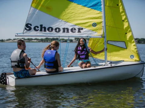 a group of people on a sailboat