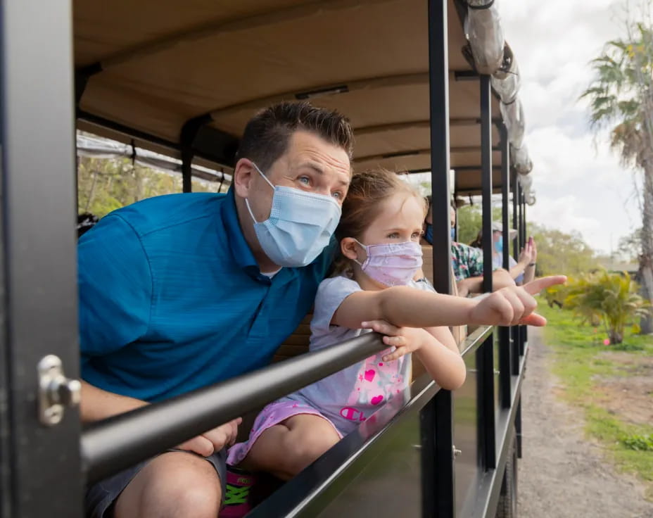 a man and a child on a ride