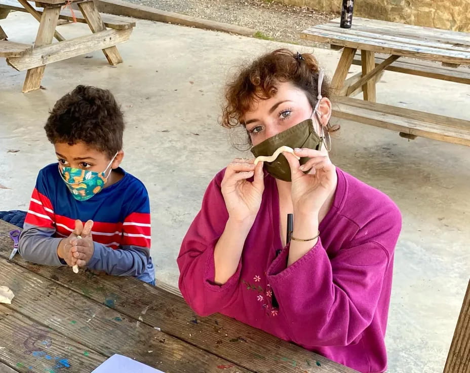 a person and a boy eating