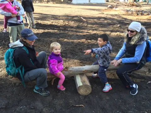 a group of people sitting on a bench