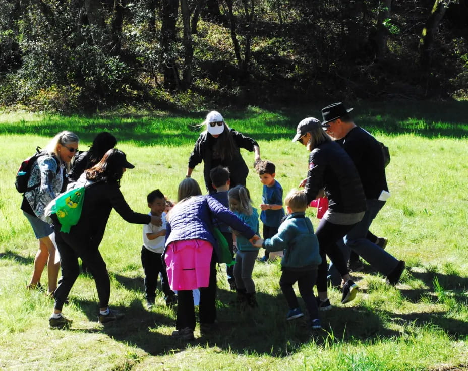 a group of people walking on a path