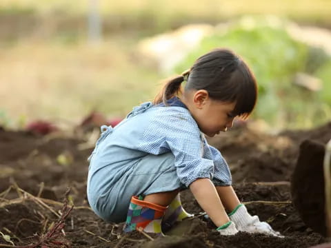 a little girl playing with a toy