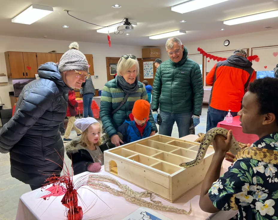 a group of people around a table