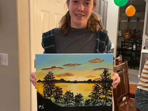 a woman holding a framed picture