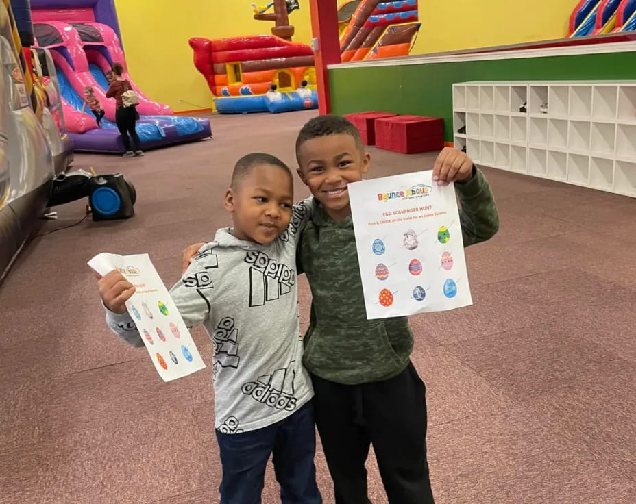 a group of boys holding up signs