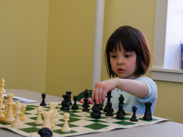 a girl playing chess