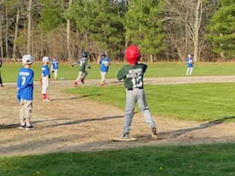 a kid in a baseball uniform