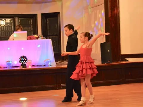 a man and woman dancing