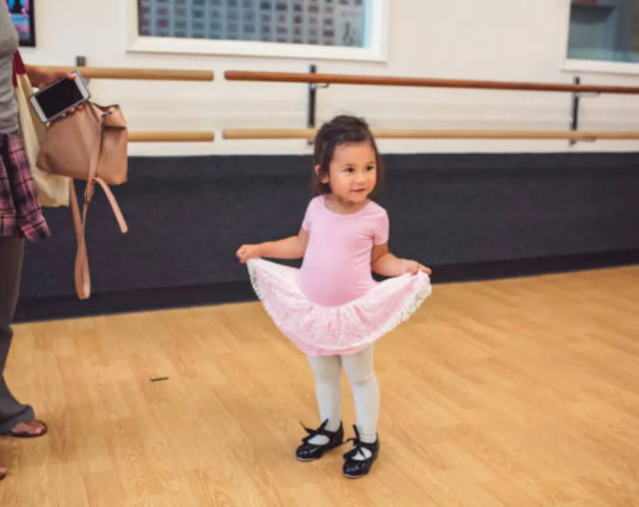 a girl in a pink dress