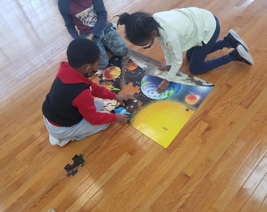 a group of kids playing with toys