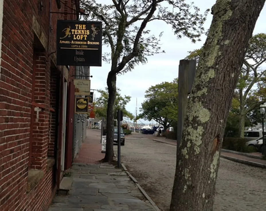 a sidewalk with a sign on it