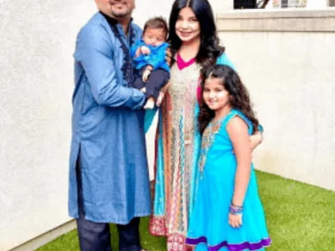 a man and woman with children