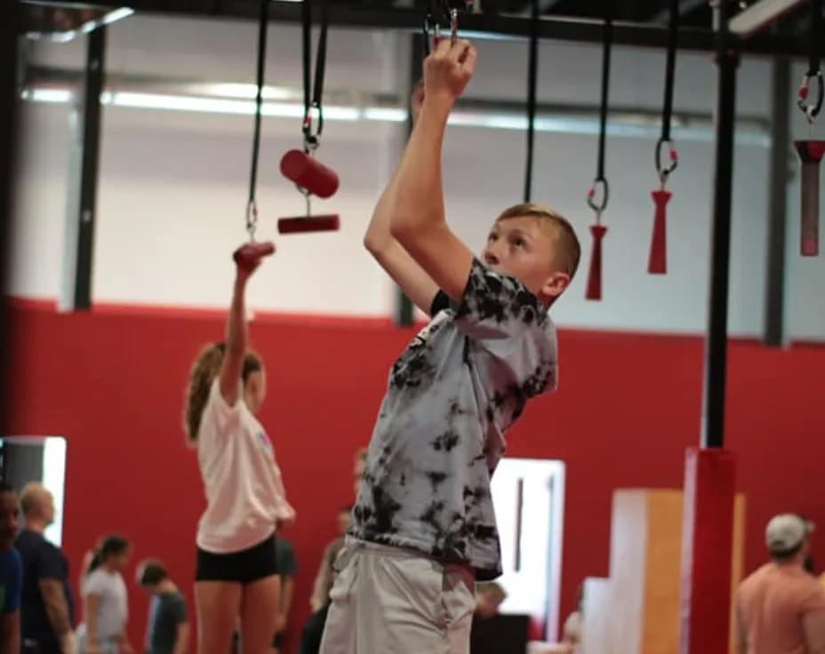 a boy holding a ball