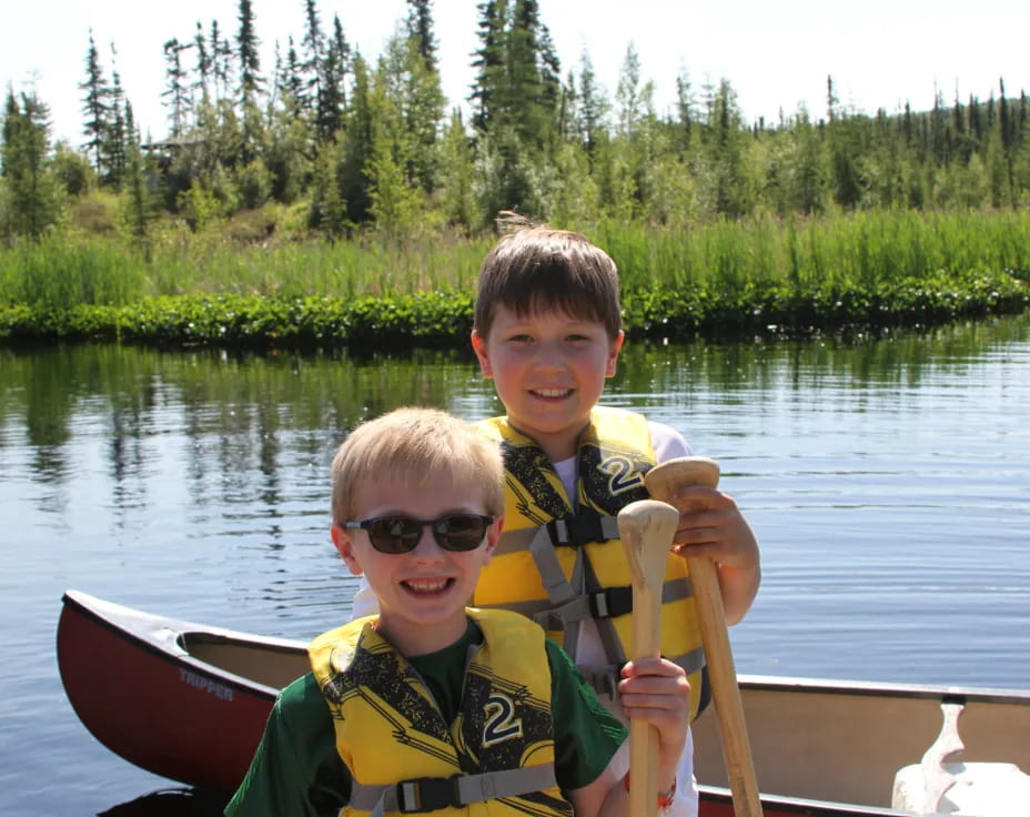 two boys in a canoe