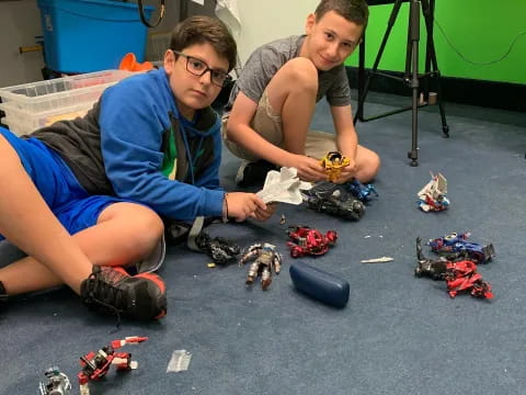 two men kneeling on the ground