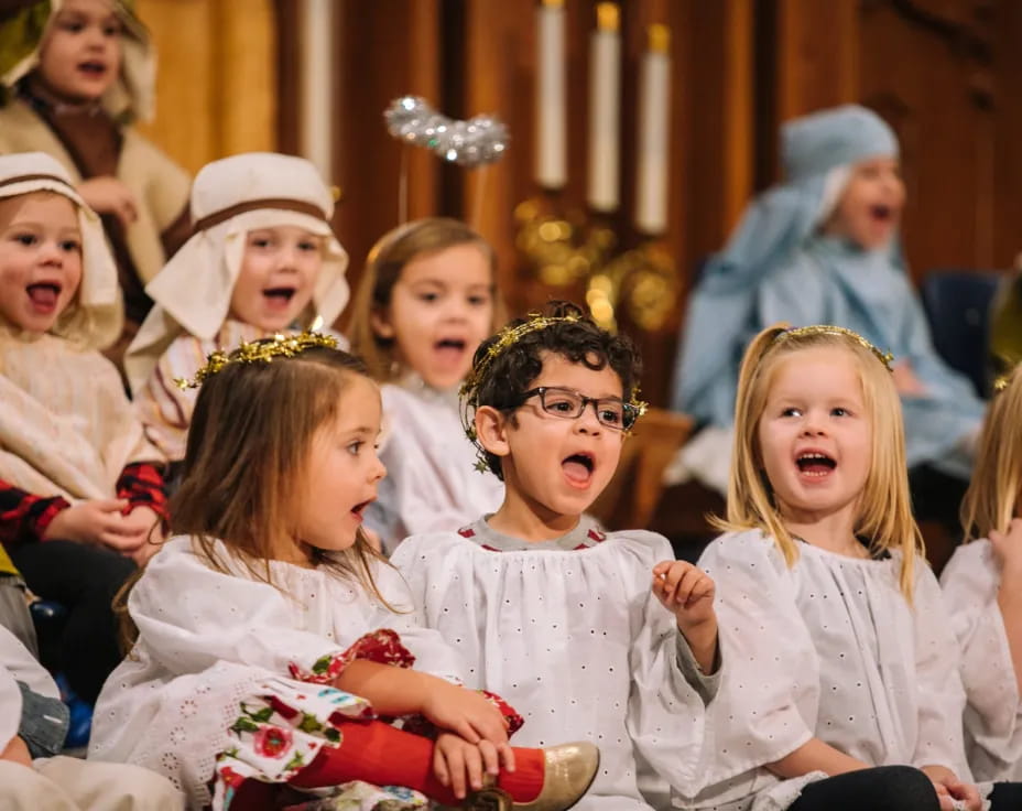 a group of children in white