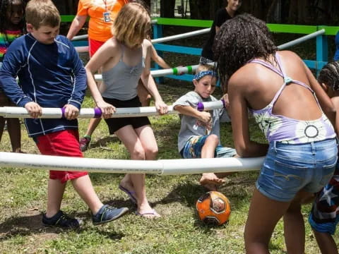 a group of kids playing football