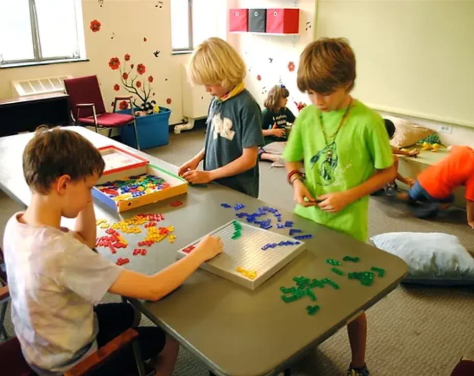 a group of children playing a board game