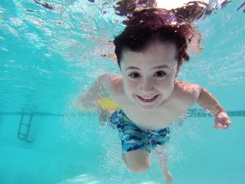 a boy in a pool