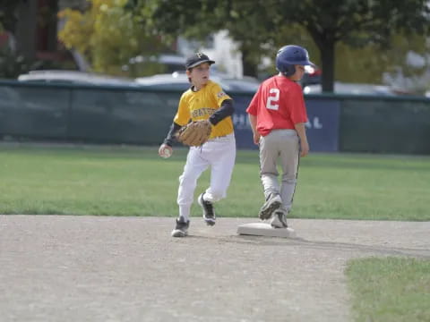 a couple of kids playing baseball