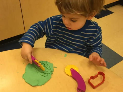 a child painting on a table