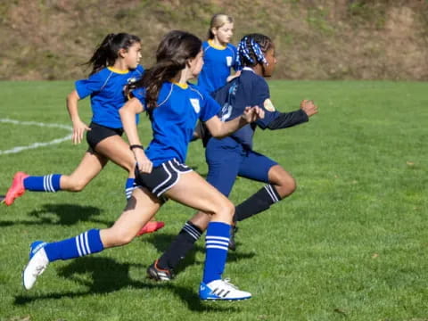 a group of girls playing football