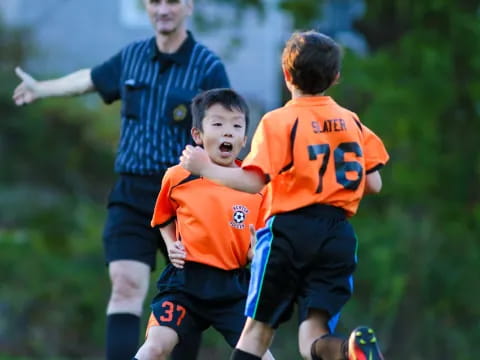 a group of boys playing football