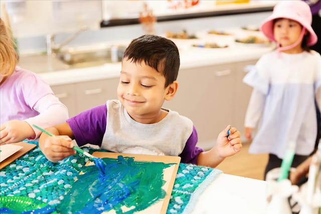 a young boy painting