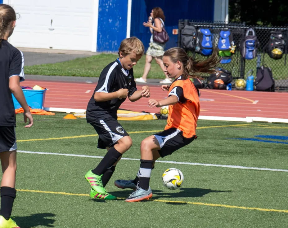 kids playing football on a field
