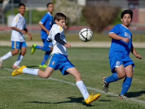 a group of boys playing football