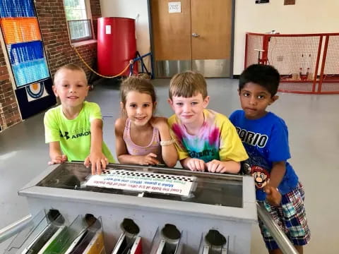 a group of children in a pool
