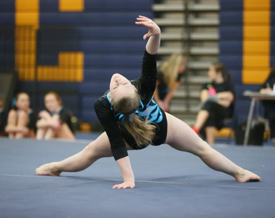 a person doing a gymnastics move