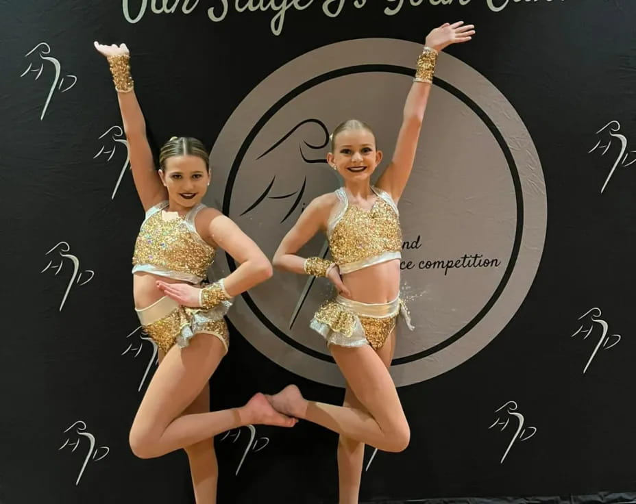 a group of women dancing on a stage