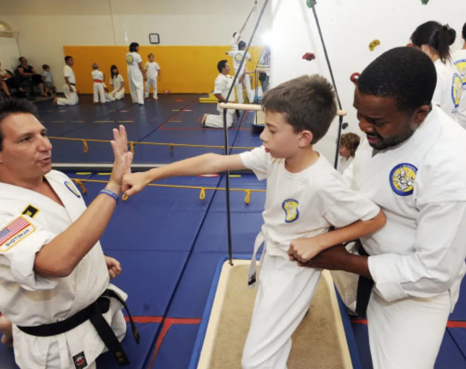 a group of boys in karate uniforms